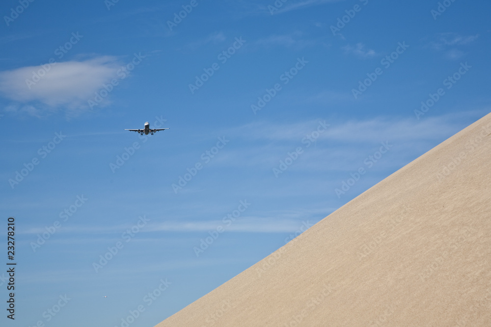 gravel pit hill with approaching aircraft gravel pit hill with approaching aircraft