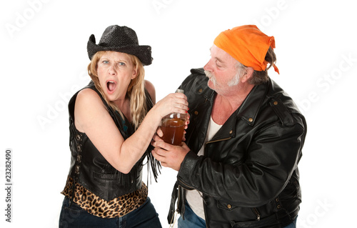 фотографія Motorcyle gang couple arguing about a beer bottle