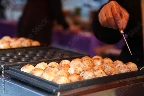 Japanese takoyaki being prepared at a food market