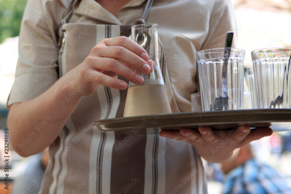 Waitress with decanter of liqueur Waitress with decanter of liqueur