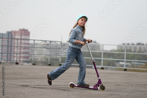 girl running scooter