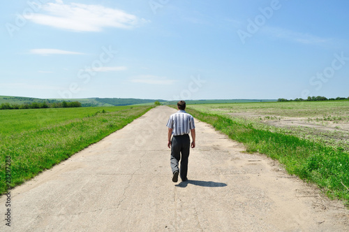 The man goes away on the road