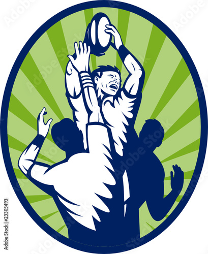 Rugby player jumping catching ball