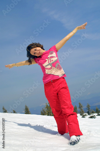 Happy girl relax on a mountain slope