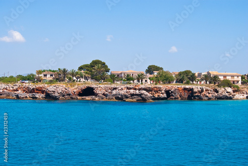 Fototapeta Naklejka Na Ścianę i Meble -  Cala Mendia shore and residential houses, Majorca island