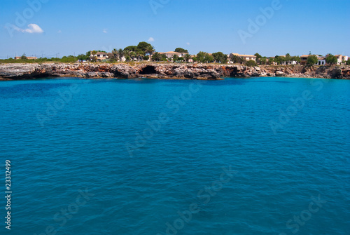 Turquoise waters of Mediterranean Sea at Cala Mendia, Majorca i