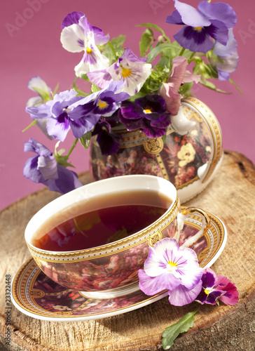 flavored tea in a porcelain bowl and a flower