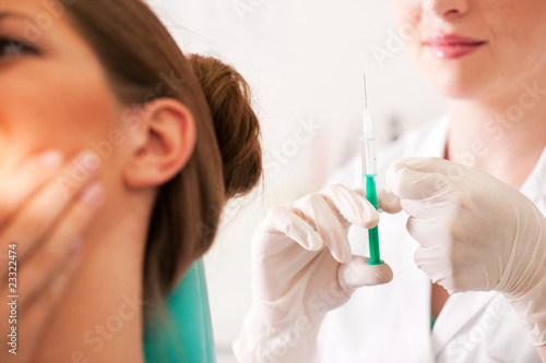 patient at dentist receiving anesthetization