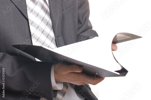business man holding stack of files and folders