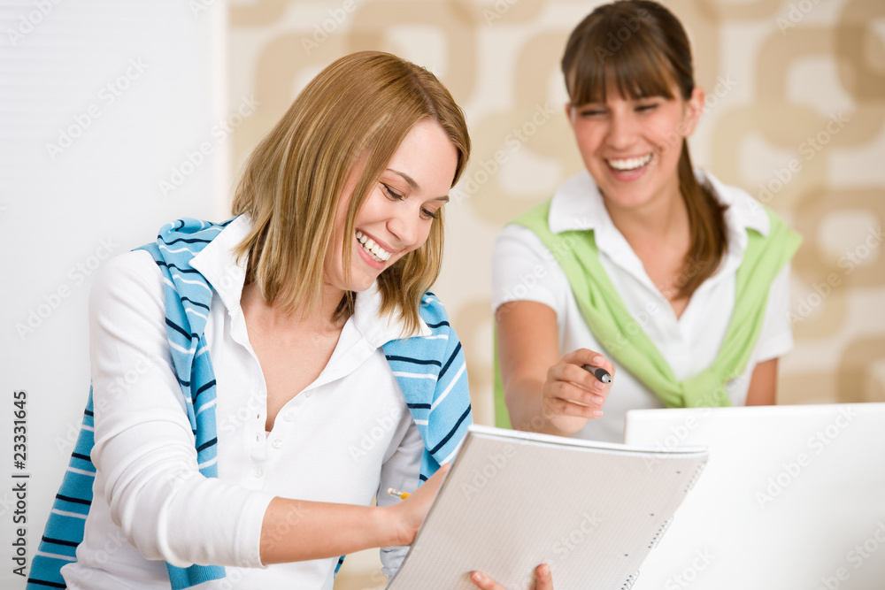 Student at home - two happy woman with laptop