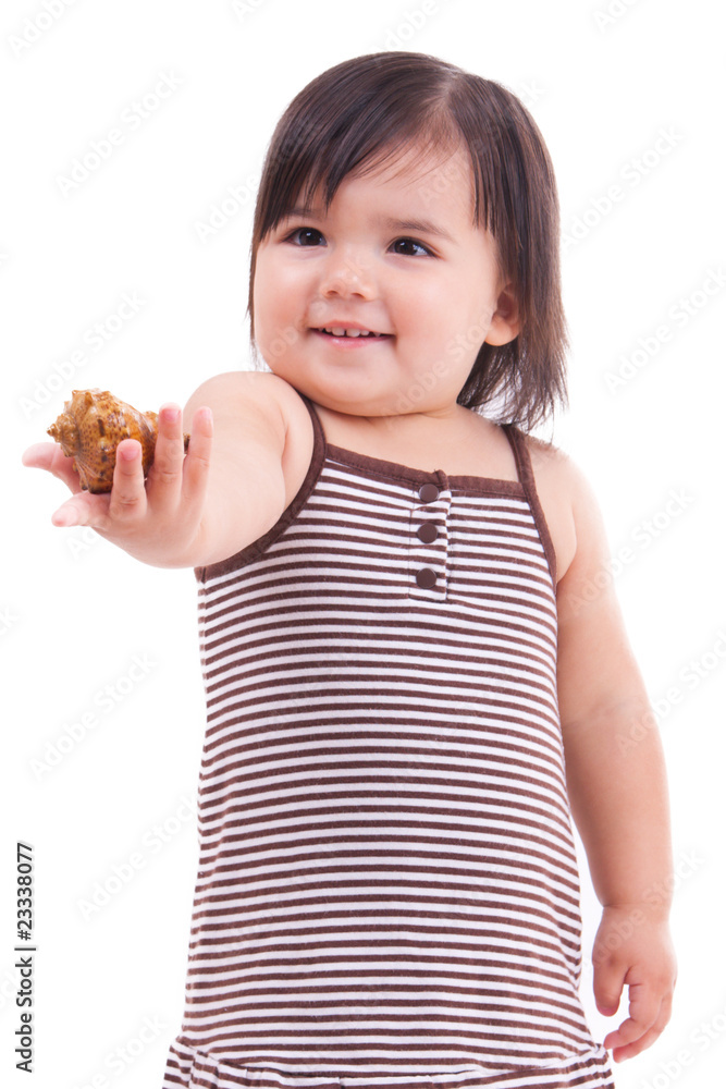 Little girl outstretching a sea shell in her hand Little girl outstretching a sea shell in her hand