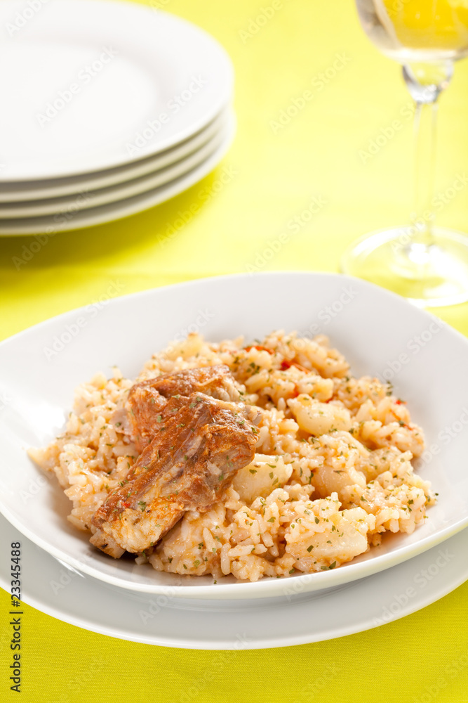 plate of rice and pork chops potatoes