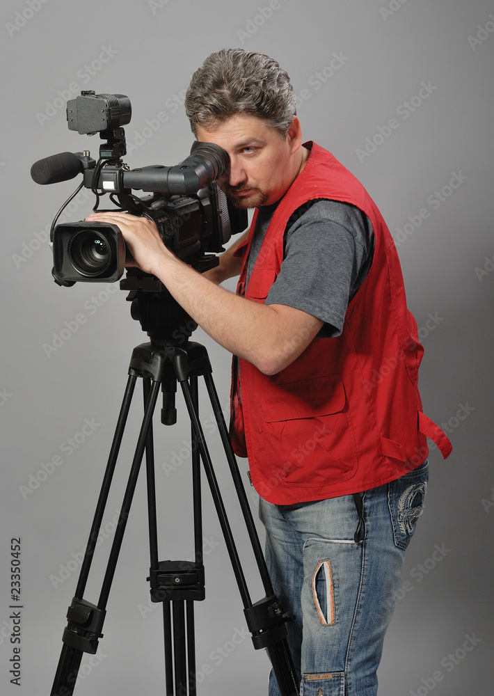 Cameraman in red vest