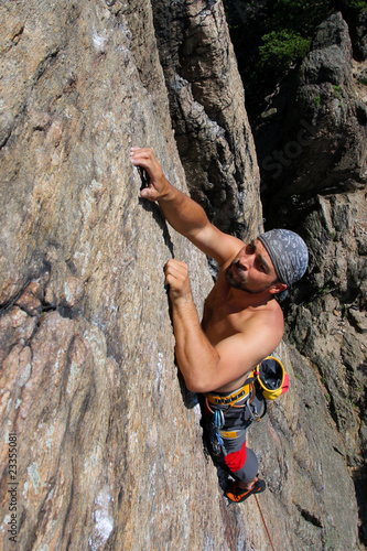 Male rock-climber on a granite wall