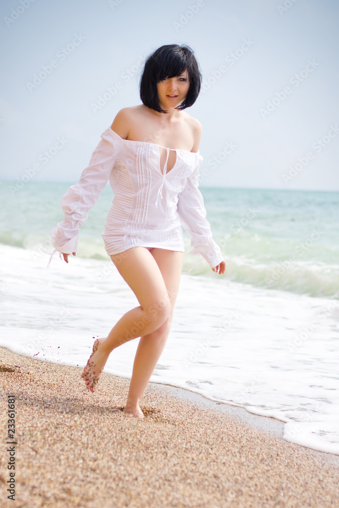 Attractive young woman relaxing at the beach Attractive young woman relaxing at the beach