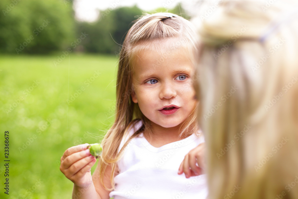 a little girl is talking with her mother a little girl is talking with her mother