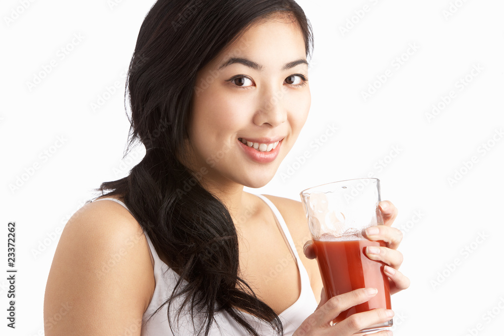 Young Woman Enjoying Healthy Drink In Studio Young Woman Enjoying Healthy Drink In Studio