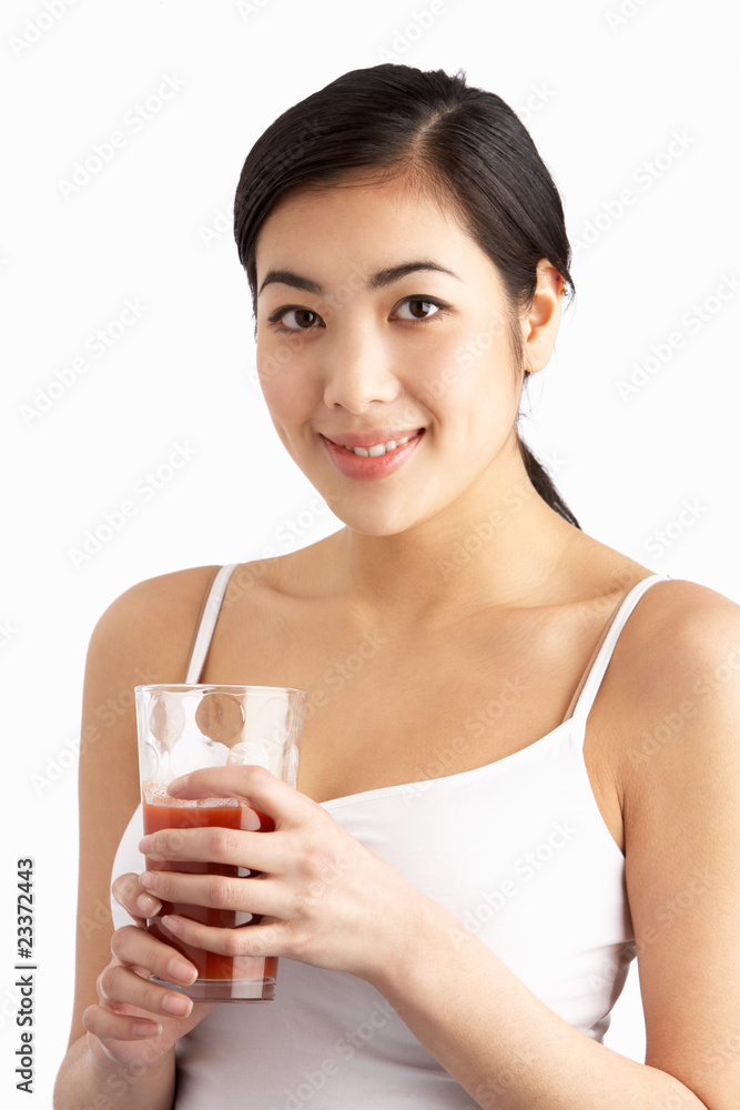 Young Woman Enjoying Healthy Drink In Studio Young Woman Enjoying Healthy Drink In Studio