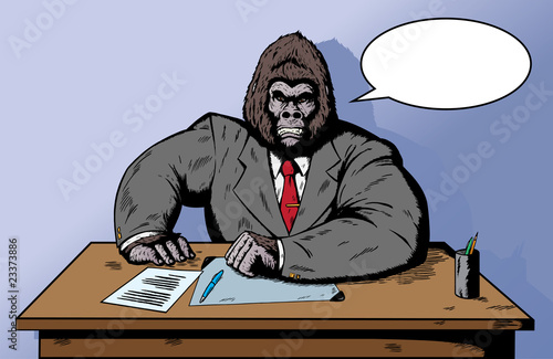 Gorilla in suit at desk photo