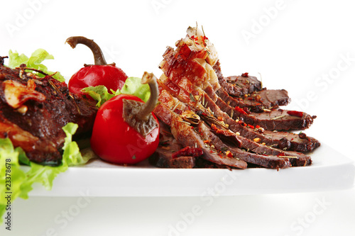 served meat on ceramic plate
