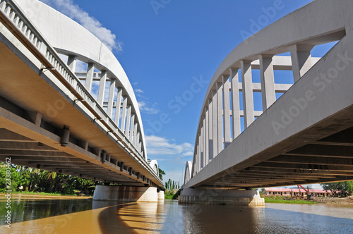 white and concrete bridge across the river