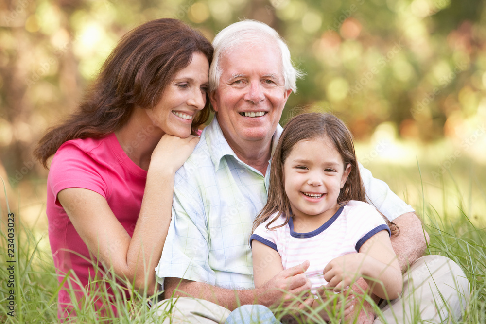Fototapeta premium Grandfather With Daughter And Granddaughter In Park
