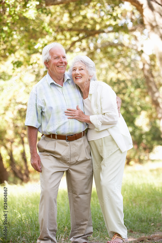 Senior Couple Walking In Park