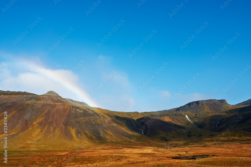 Beautiful rainbow over the mountains, North Fjords Iceland
