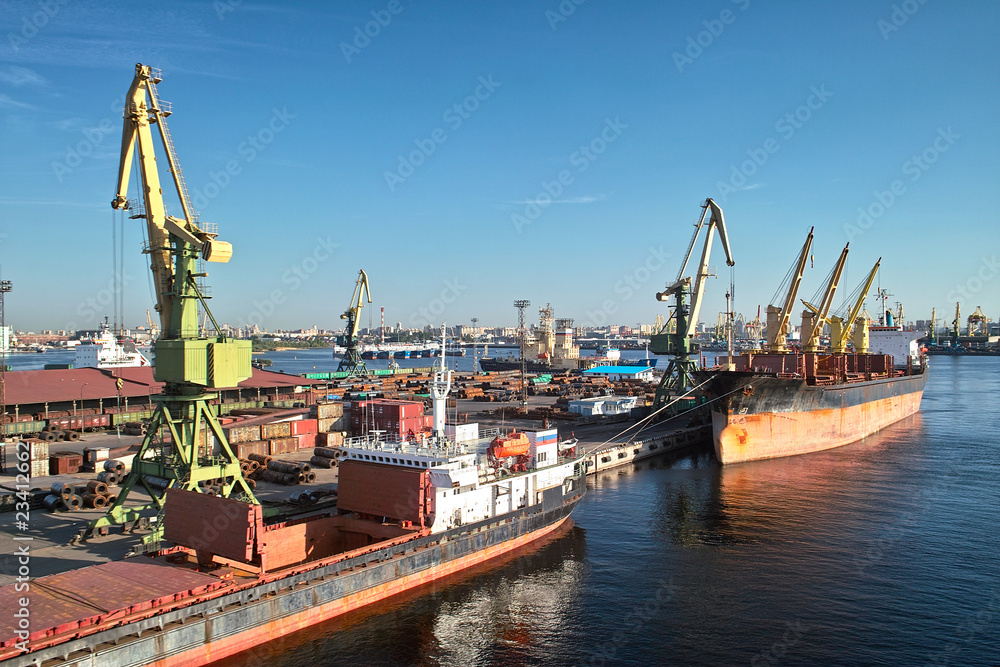 Fototapeta premium Cargoships and cranes in the harbor