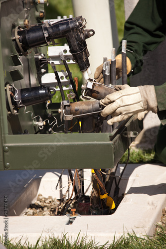 Utility Workers Installing New Electrical Equipment