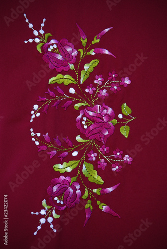 hand made flowers satin-stitch embroidery on the textile
