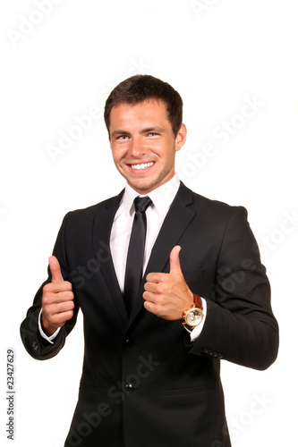 Young happy business man going thumbs up