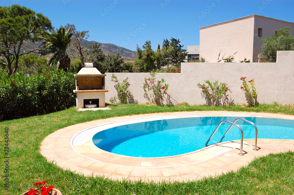Grill at swimming pool by luxury villa, Crete, Greece