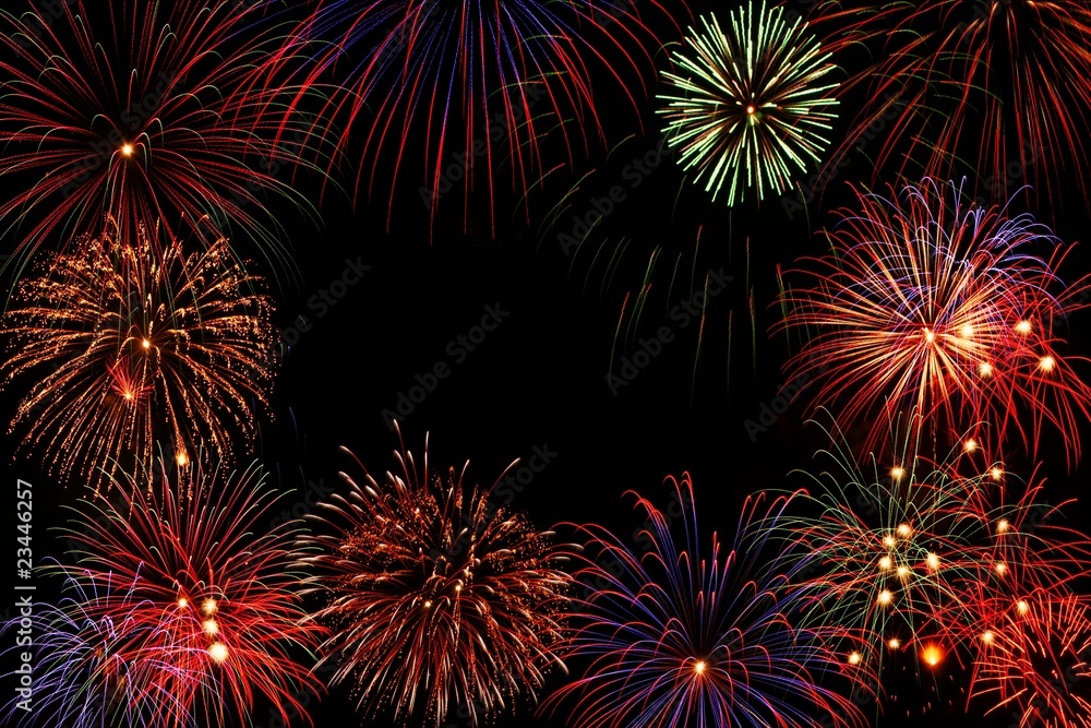 Naklejka premium Composition of colorful fireworks over black background