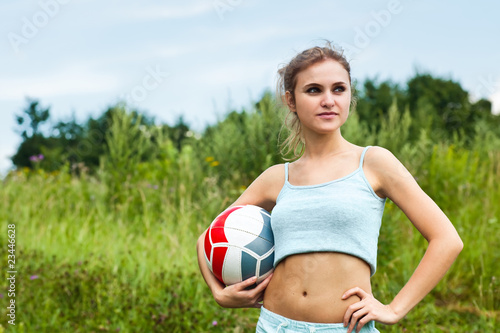 Fototapeta Naklejka Na Ścianę i Meble -  Attractive girl with volleyball ball