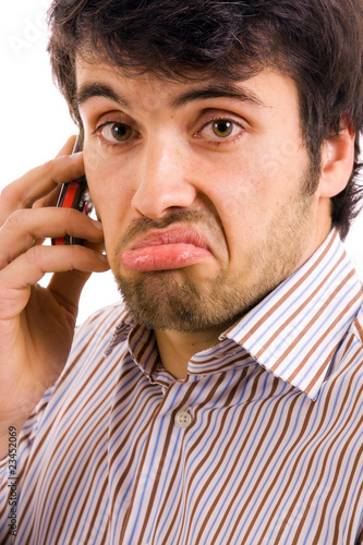 young casual man on the phone, isolated on white photo