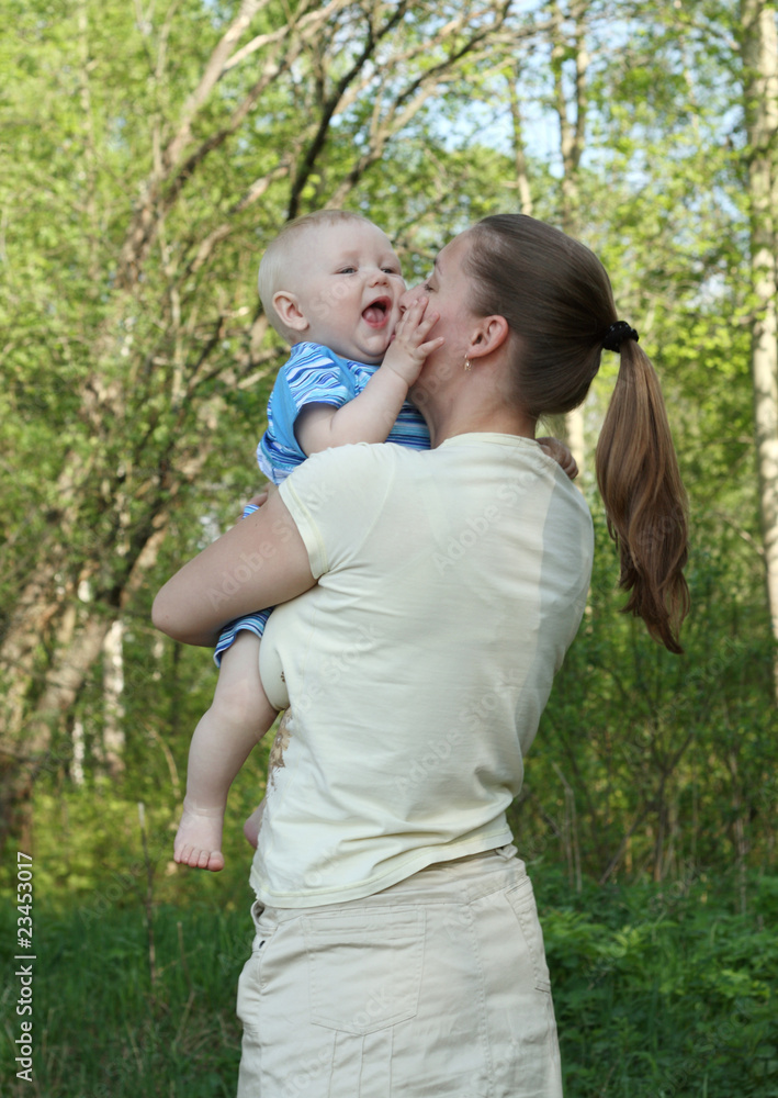 mother with her baby in the park.