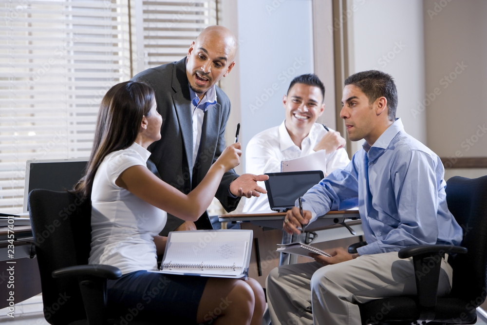 Manager meeting with office workers, directing Manager meeting with office workers, directing