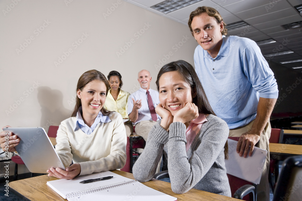 Group of college students and teacher in class Group of college students and teacher in class