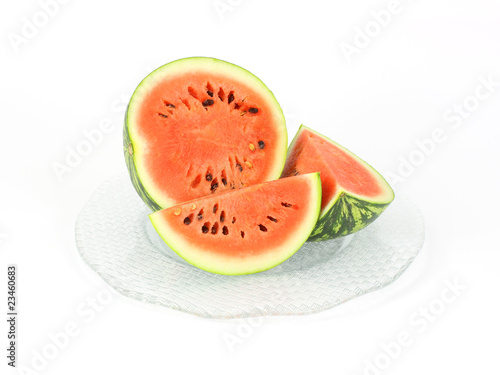 Small baby watermelon cut on a large glass platter