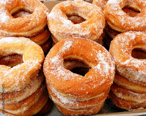 Piles of greek round sugar donuts 