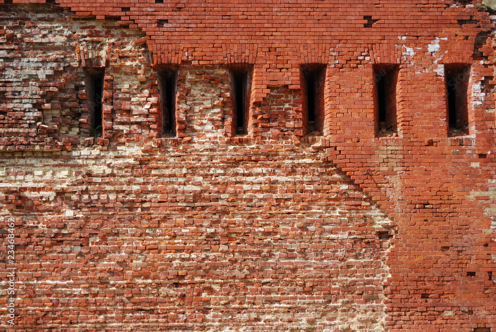 Loopholes in an old brick wall