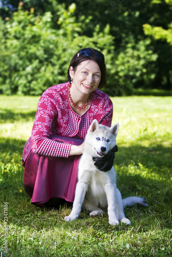 Woman and puppy siberian husky