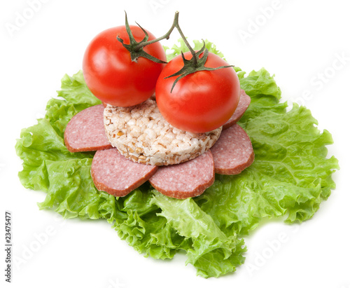 Sandwich with sausage, tomatoes and salad