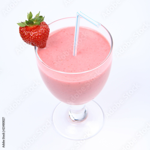 Strawberry shake in a glass,a straw decorated with a strawberry