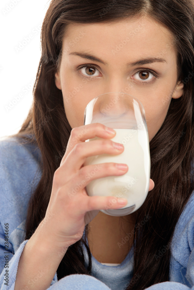 Young woman drinking milk