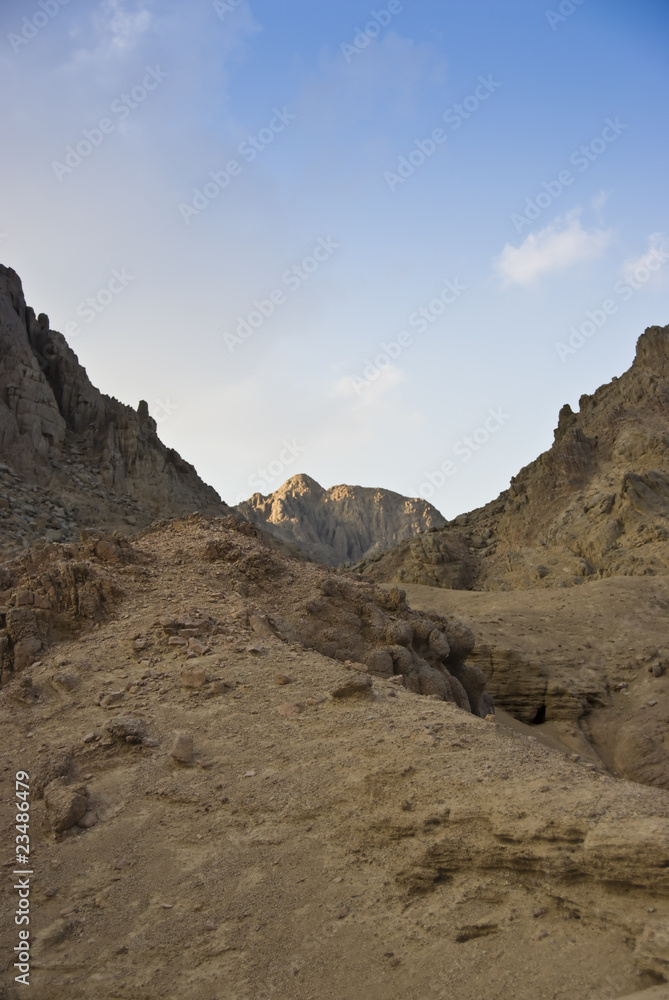 Scenic of desert mountains with blue sky.