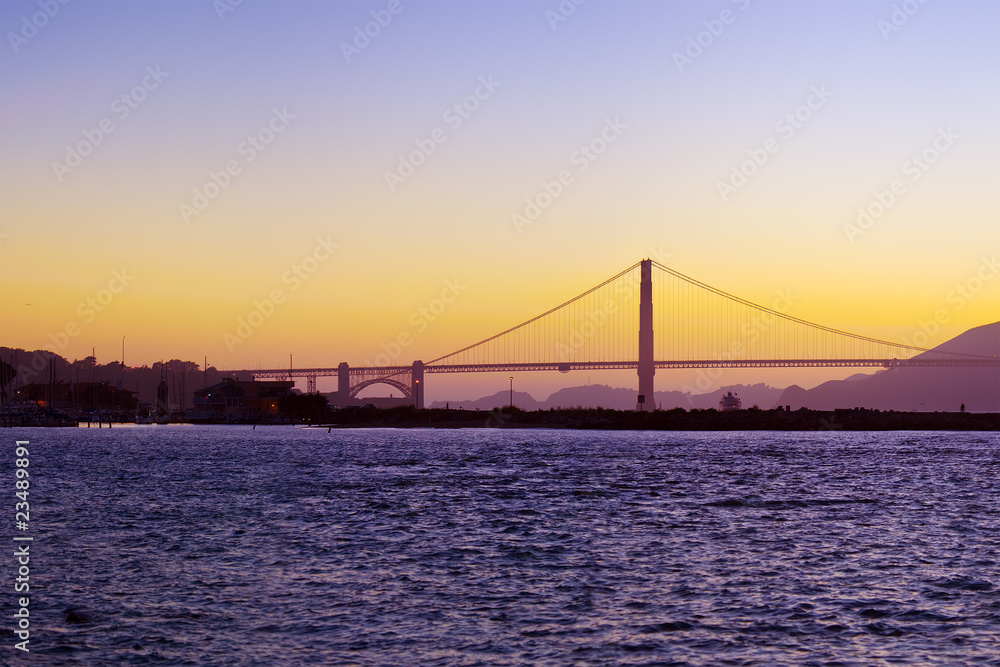 The Golden Gate Bridge silhouetted at sunset