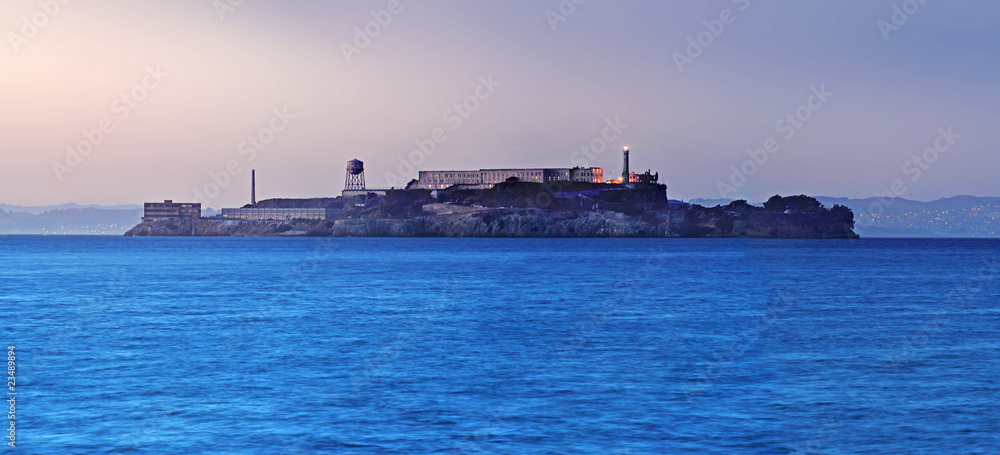 Alcatraz Island under a dramatic dusk sky