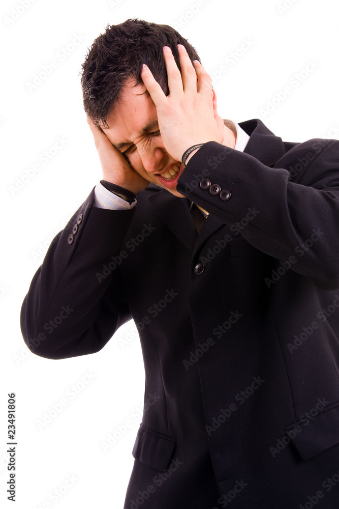 Young business man in agony with a headache, isolated on white Young business man in agony with a headache, isolated on white